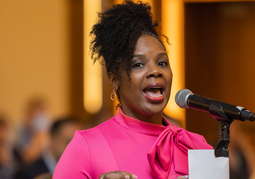 Dr. Johnson-foy speaks at a microphone