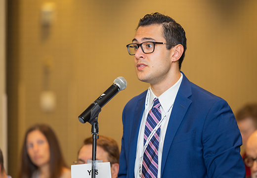 Man providing a testimony from Annual Meeting