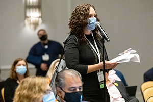 Woman speaking at a microphone