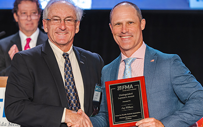 Jay Millson receives an award from Dr. Murphy at Annual Meeting 2022